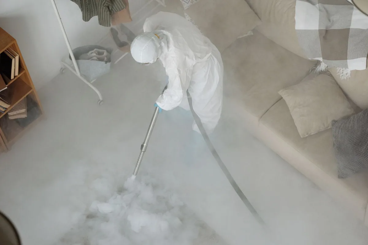 Biohazard cleanup technician in protective equipment, Cornwall, PA